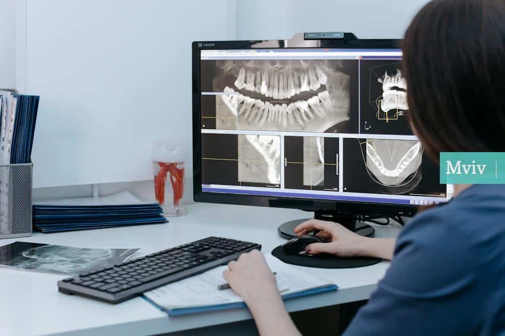 A Person Looking at Xray Image of Teeth